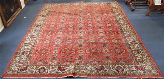 Red ground Tabriz carpet, 9ft 11in by 7ft 4in(-)